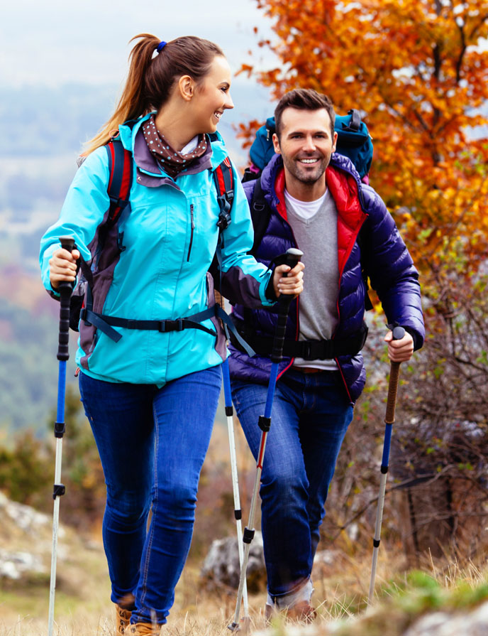 Basic Savings Account Image of man and woman hiking.