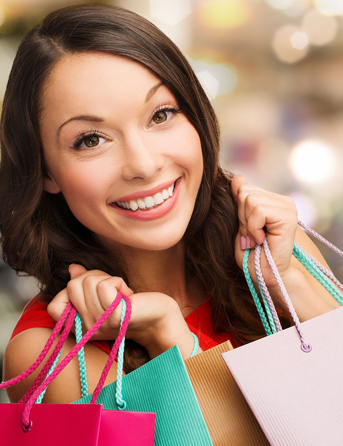 Christmas Savings Account Image of woman holding shopping bags.