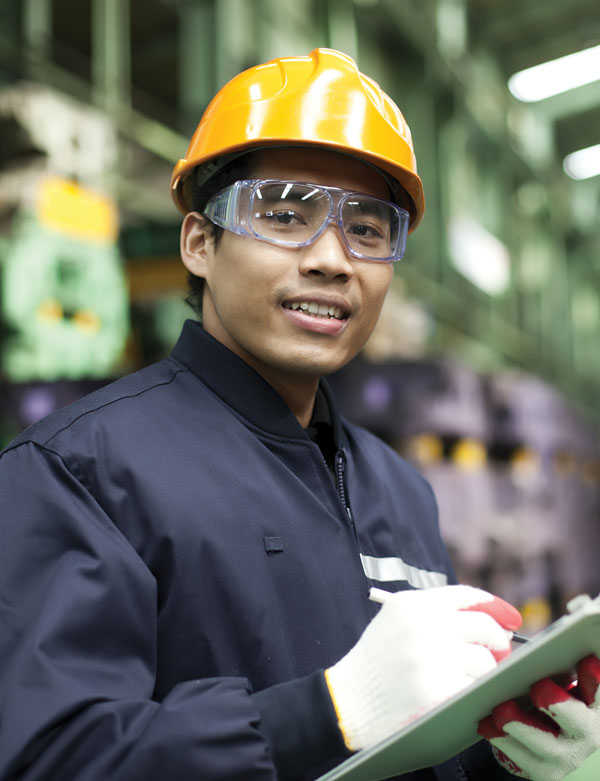Financial Decision Making man in hard hat and protective glasses smiling