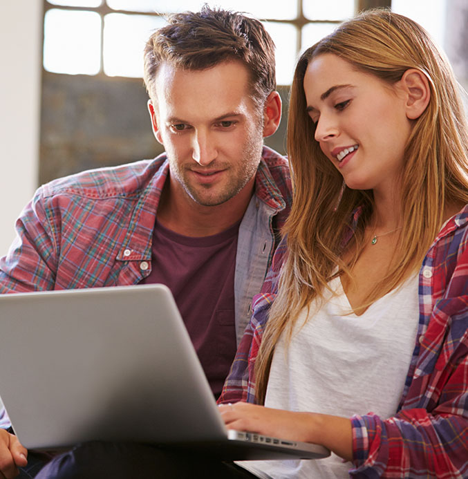 Couple looking at laptop